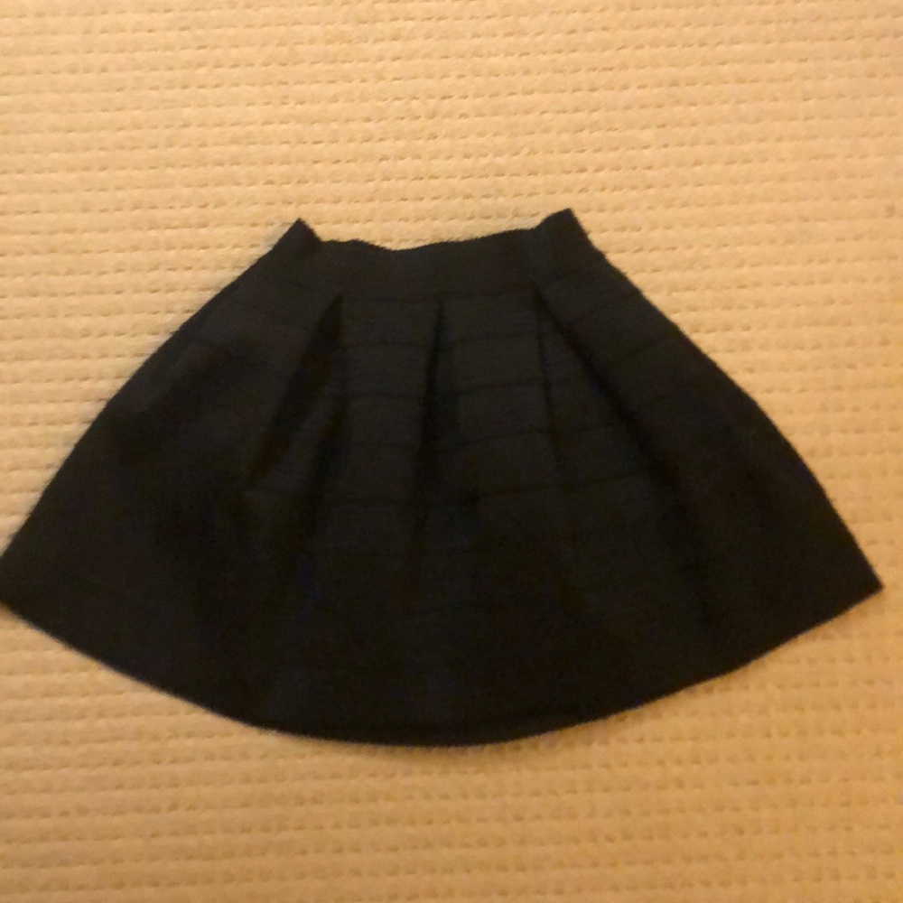 Black pleated mini skirt